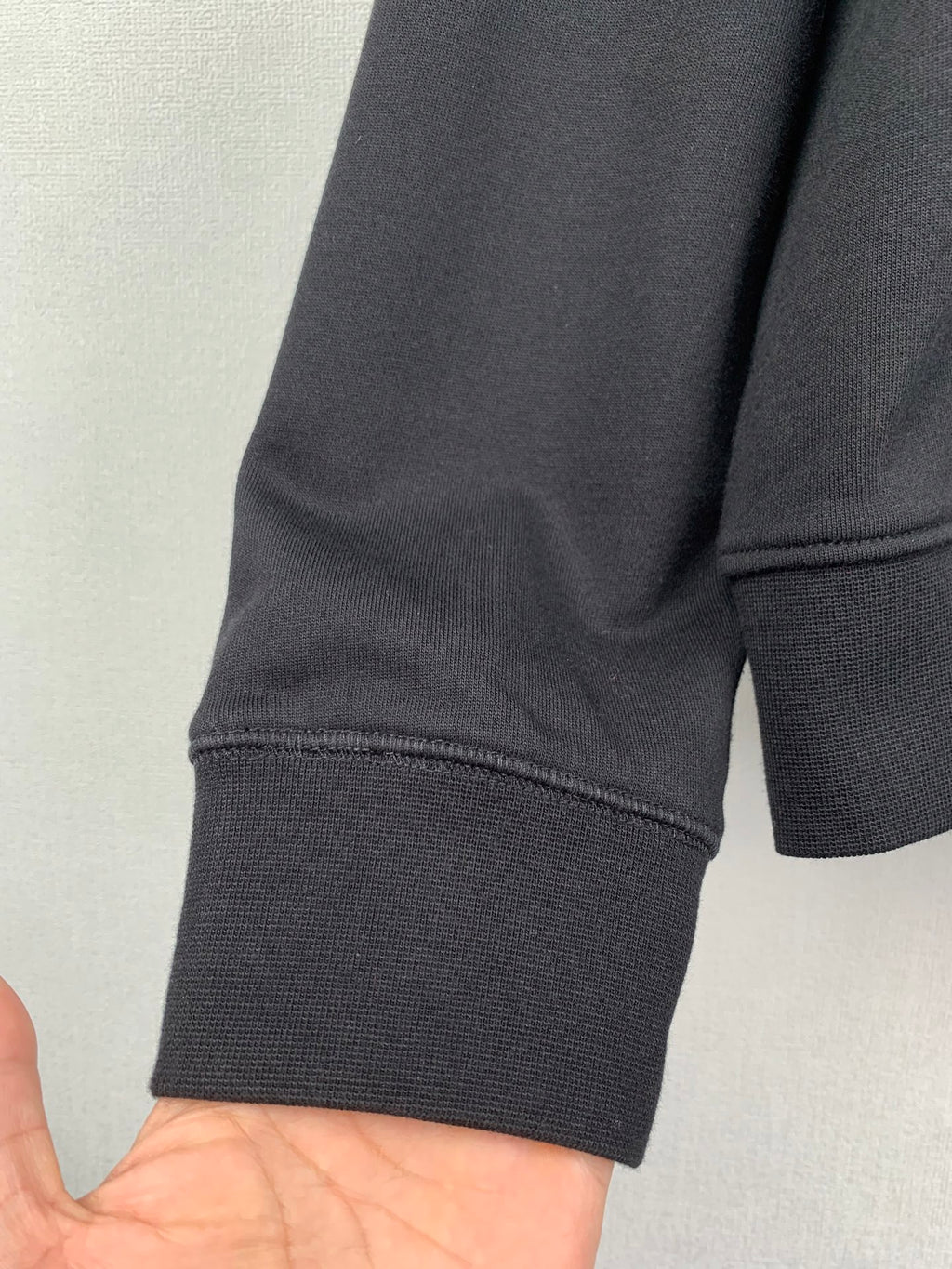 Black hoodie sleeve with ribbed cuff
