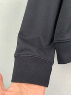 Black hoodie sleeve with ribbed cuff
