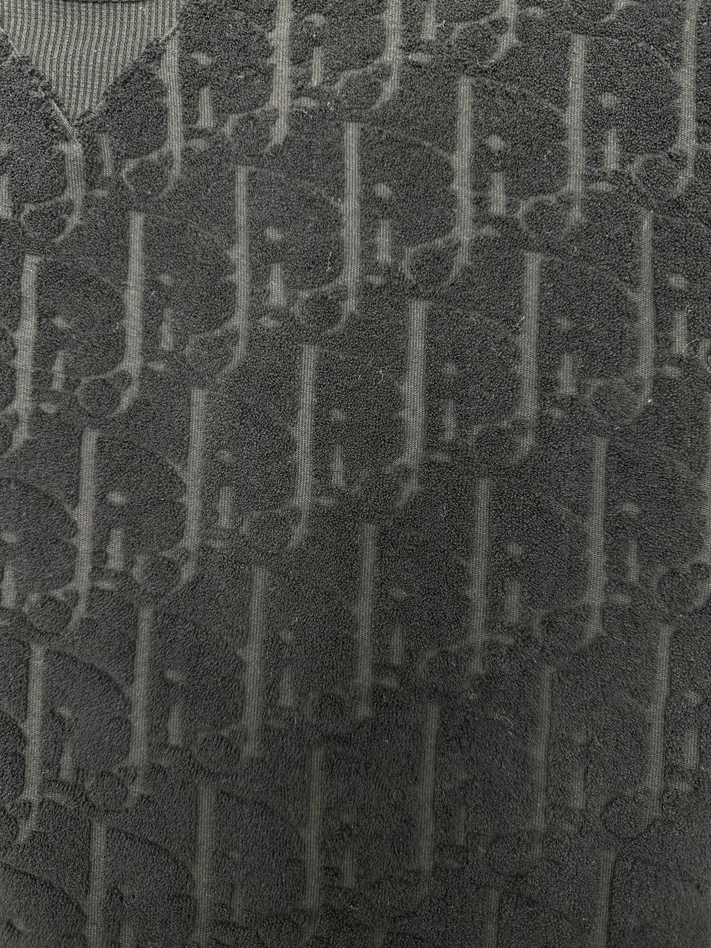 Black Dior jacquard logo texture fabric close-up
