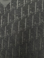 Black Dior jacquard logo texture fabric close-up