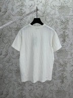 White Dior crewneck T-shirt on hanger, short sleeves and embossed fabric texture