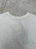 White crewneck T-shirt neckline with ribbed collar and embossed fabric texture