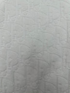 White embossed textured fabric on a short-sleeve crewneck T-shirt