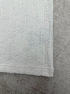 White short-sleeve T-shirt hem with embossed fabric texture and clean finish