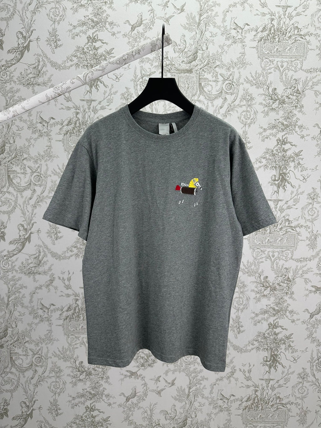 Grey short-sleeve T-shirt with crew neck and small embroidered front graphic