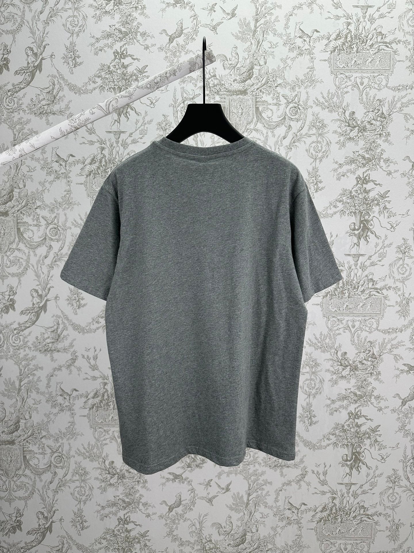 Grey short-sleeve T-shirt on hanger, crew neck, plain back