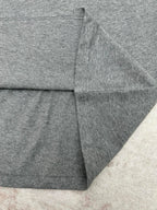 Grey T-shirt back hem and stitched seam close-up