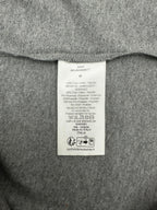 Grey T-shirt interior care label tag at collar