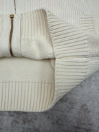 Cream knit cardigan hem with zipper edge and ribbed knit detail