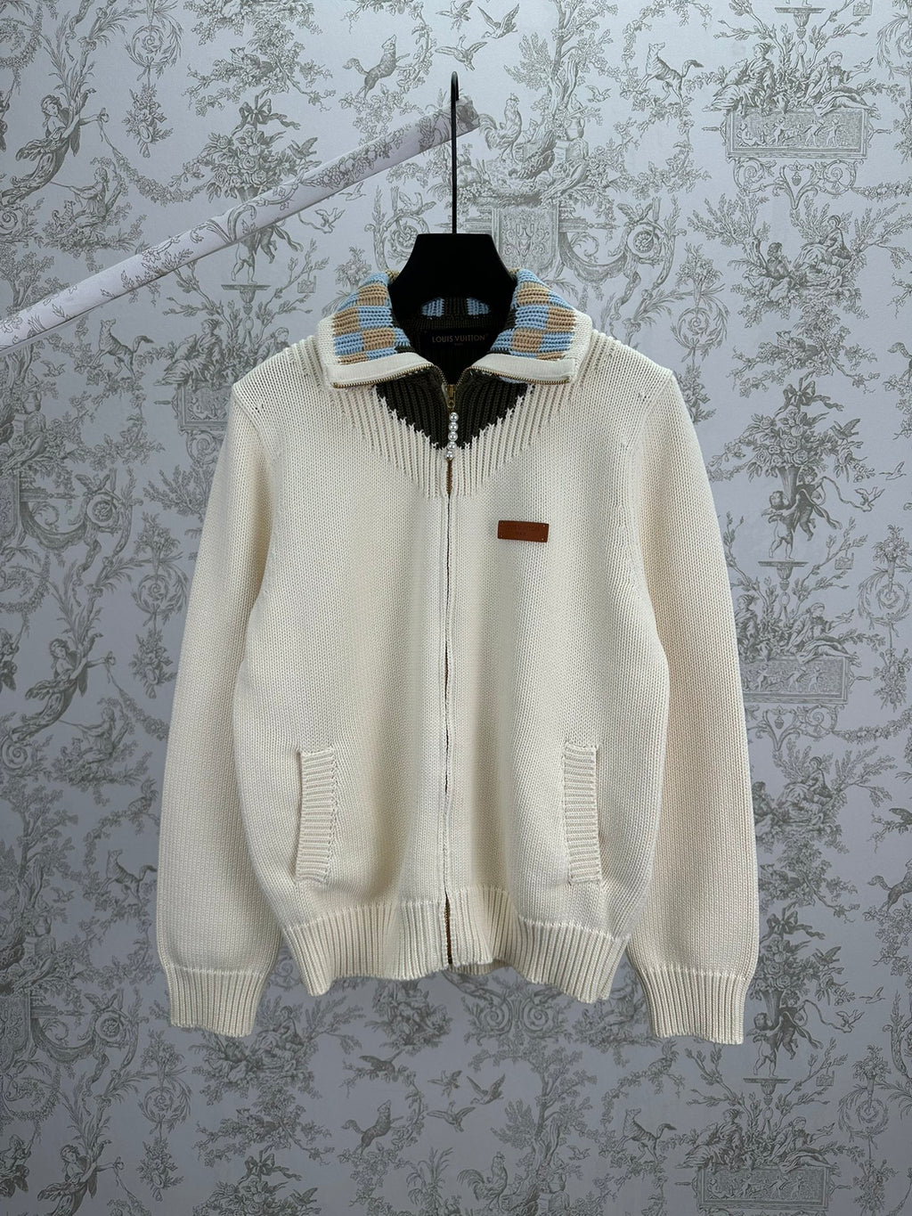Cream knit cardigan with full zipper and striped ribbed collar detail