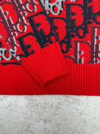 Dior knit sweater cuffs with ribbed red hem and dark blue patterned fabric panels