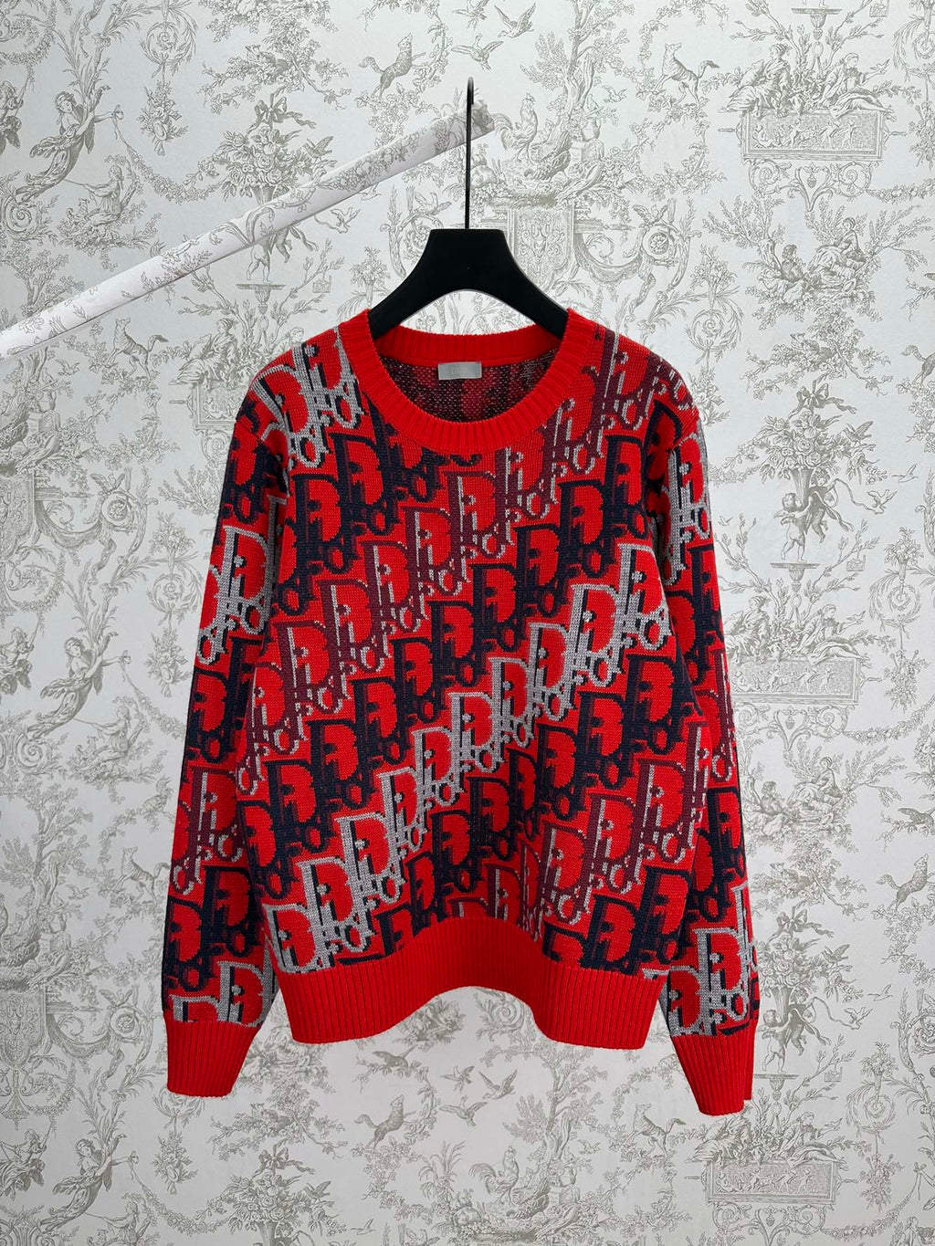 Dior knit sweater in red and dark blue with repeating logo pattern, ribbed crewneck