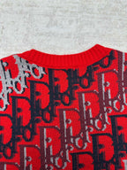 Dior knit sweater upper body with repeating red logo pattern on dark blue