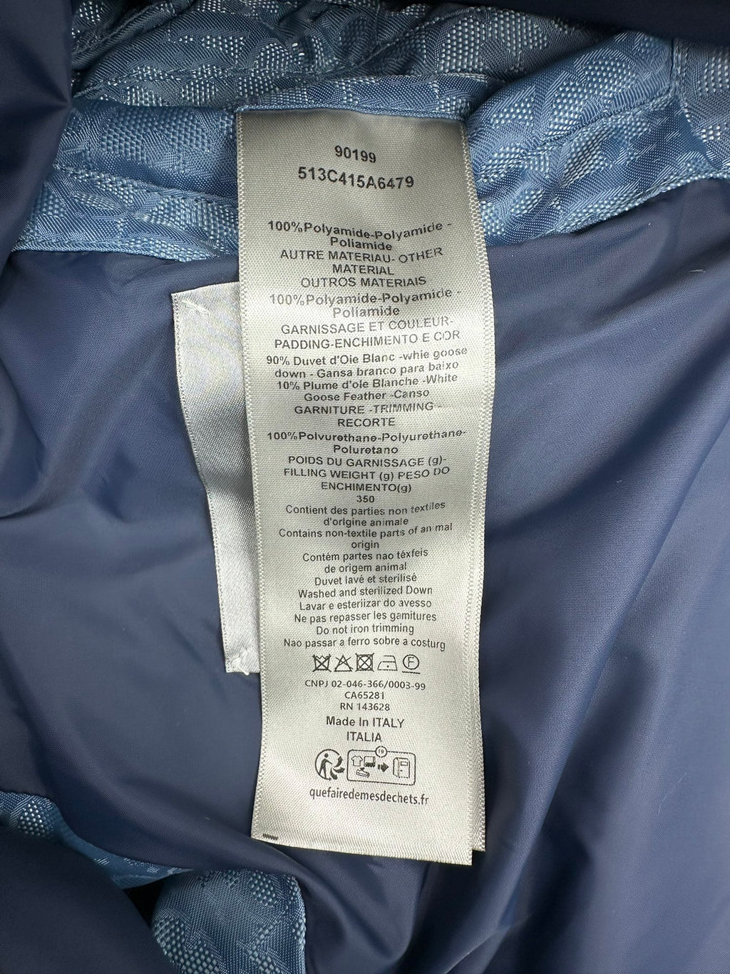 Blue Dior monogram puffer vest care label and fabric tag inside lining.