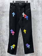 Black denim pants with multicolor cross patches, straight leg