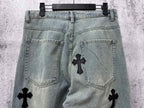 Light blue denim pants back view with pockets and black cross patches