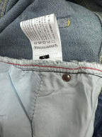 Light-wash denim pants tag and button at waistband, size S