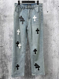Light-wash denim pants with black and white cross patches