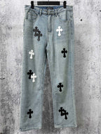 Light-wash denim pants with black and white cross patches