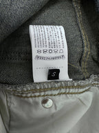Denim pants care label and size tag sewn inside the waistband