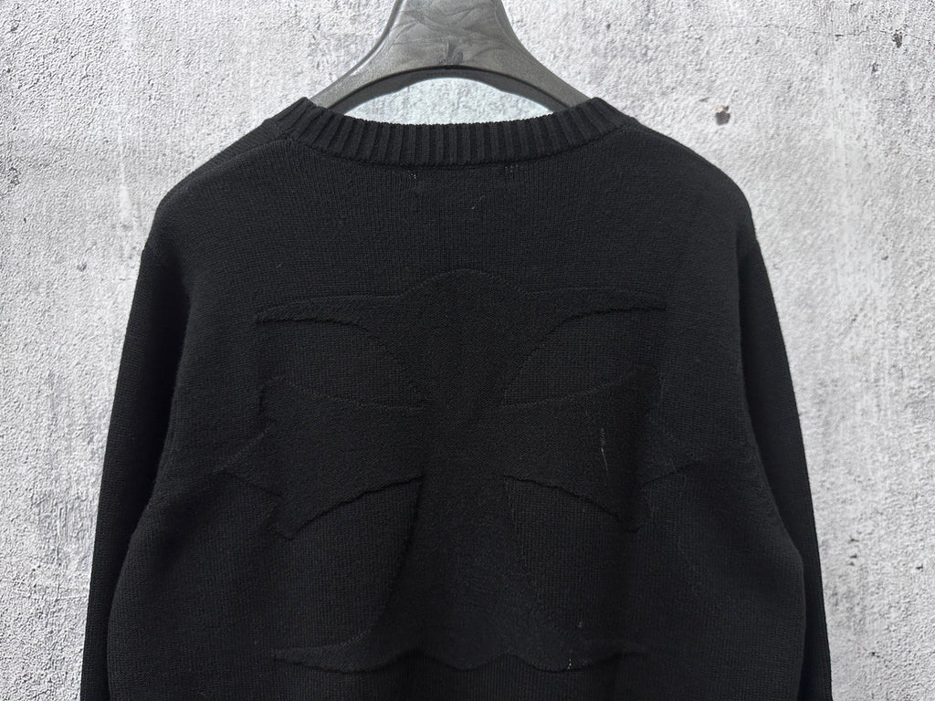 Black knit sweater back with stitched seam detailing