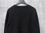Black knit sweater back with stitched seam detailing