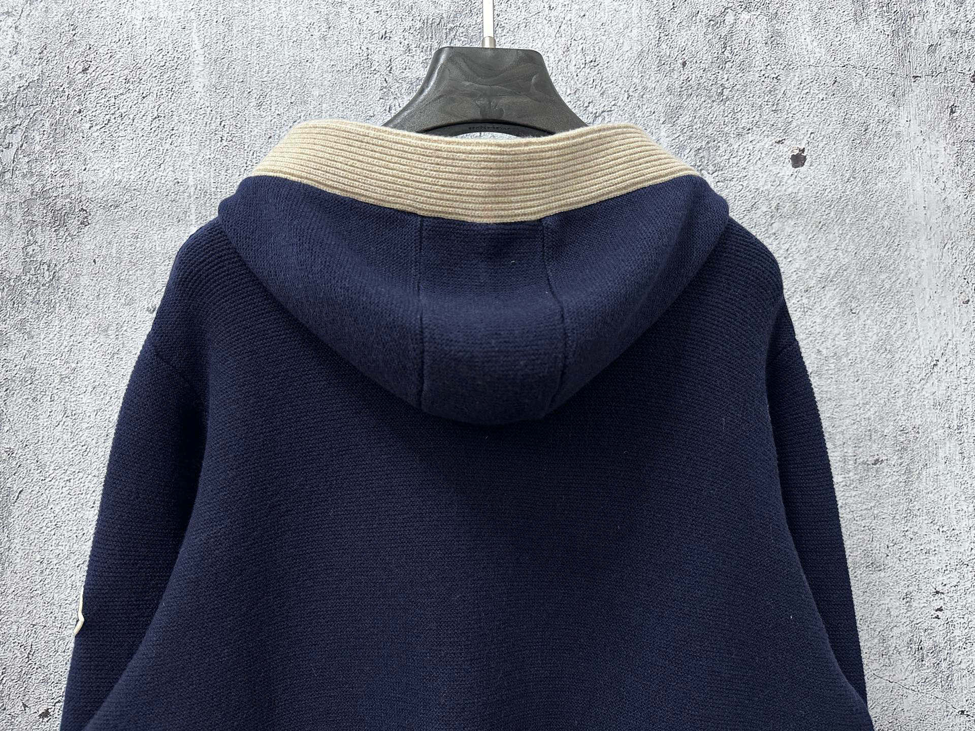 Moncler long navy knit hoodie back view with cream ribbed hood trim