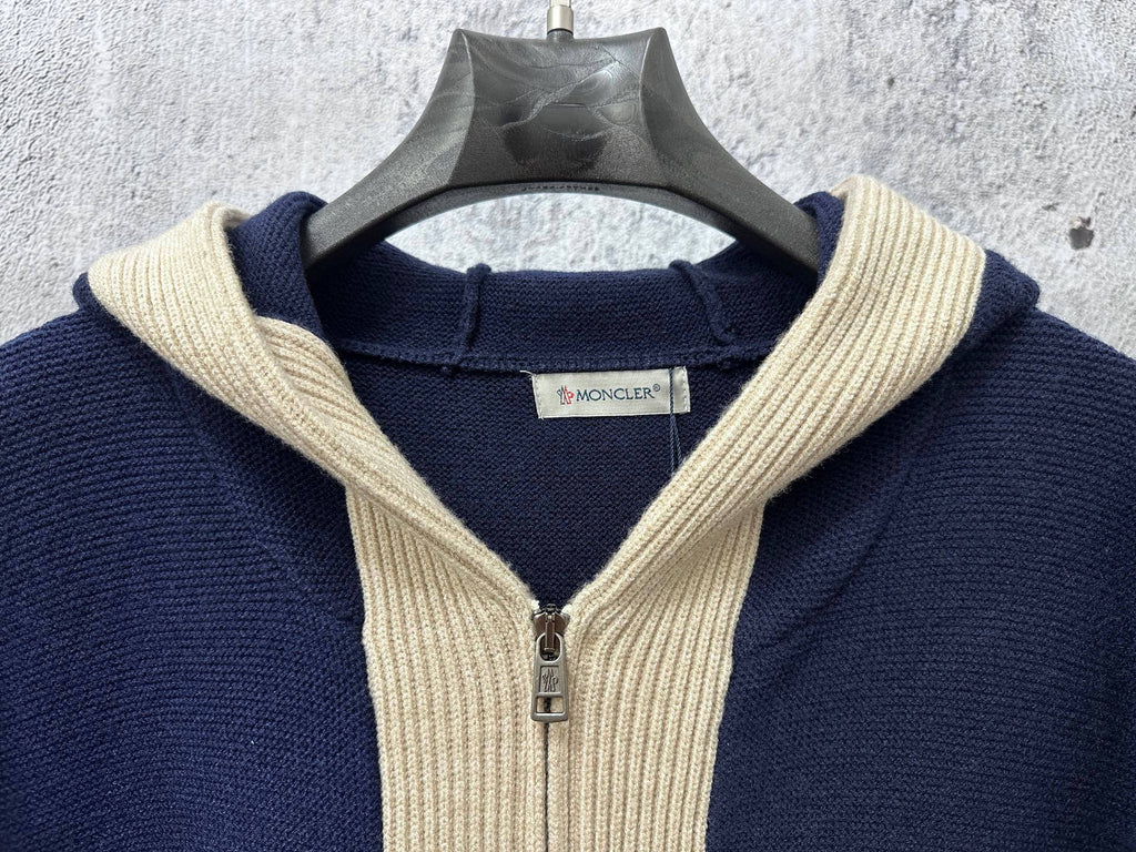 Moncler navy knit hoodie neckline with cream ribbed hood and silver zipper pull
