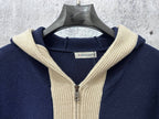 Moncler navy knit hoodie neckline with cream ribbed hood and silver zipper pull