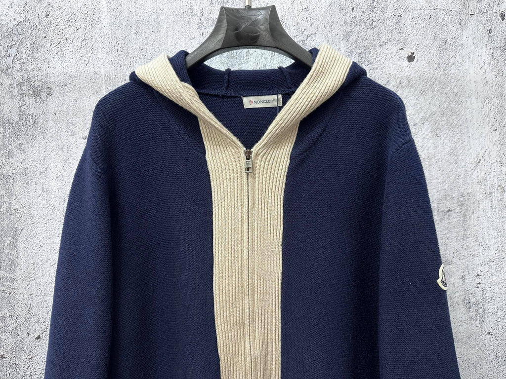 Moncler long navy knit hoodie front view with cream ribbed hood and zipper