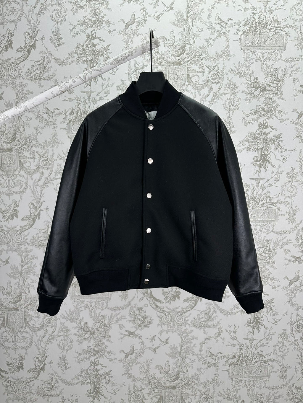 Black bomber jacket with snap button placket and ribbed cuffs