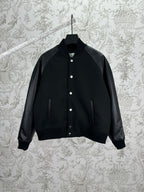 Black bomber jacket with snap button placket and ribbed cuffs