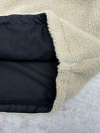Cream sherpa jacket lining and side opening with dark interior panel