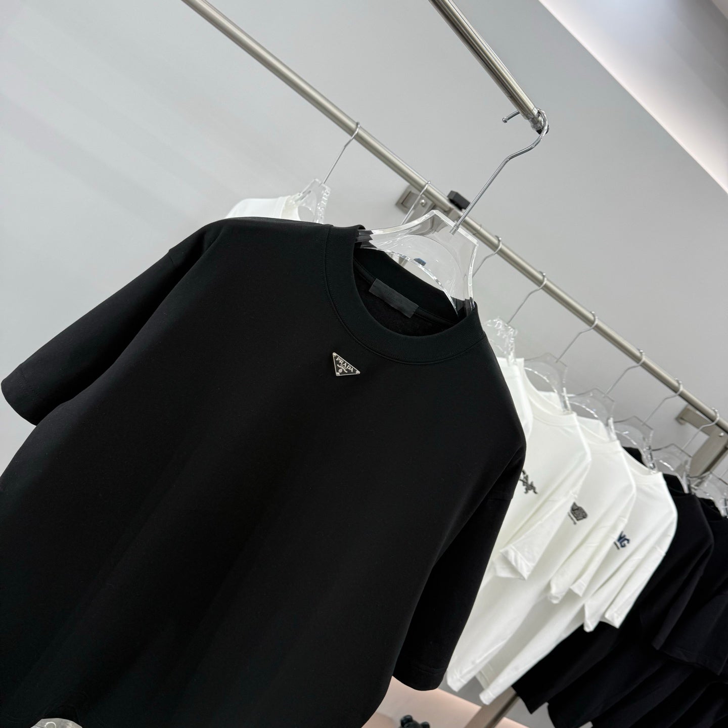 Prada short-sleeve T-shirt, black, chest close-up with small logo