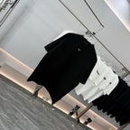 Prada short-sleeve T-shirt, black, angled view with small chest logo