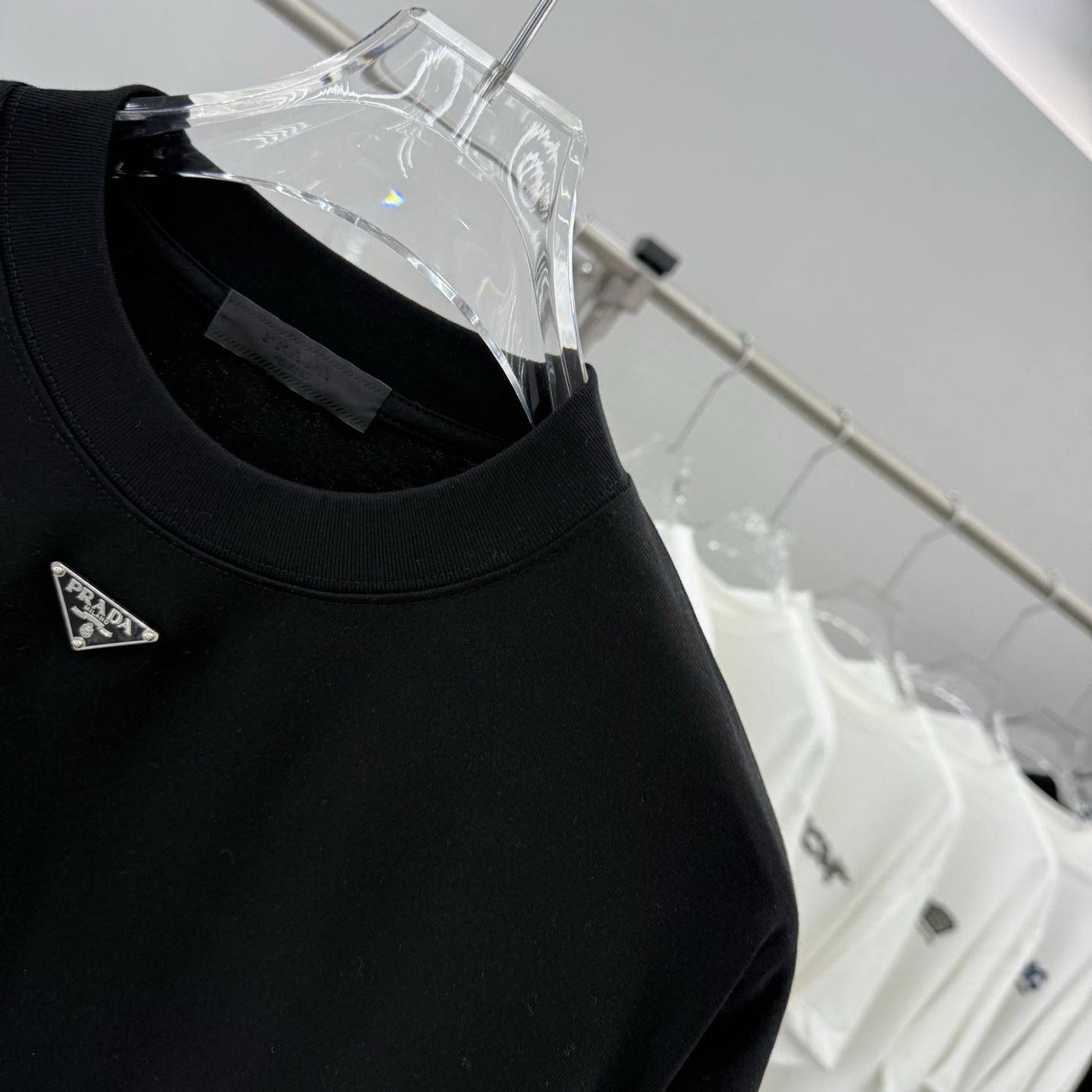 Prada short-sleeve T-shirt, black, crew neck and triangular chest logo pin