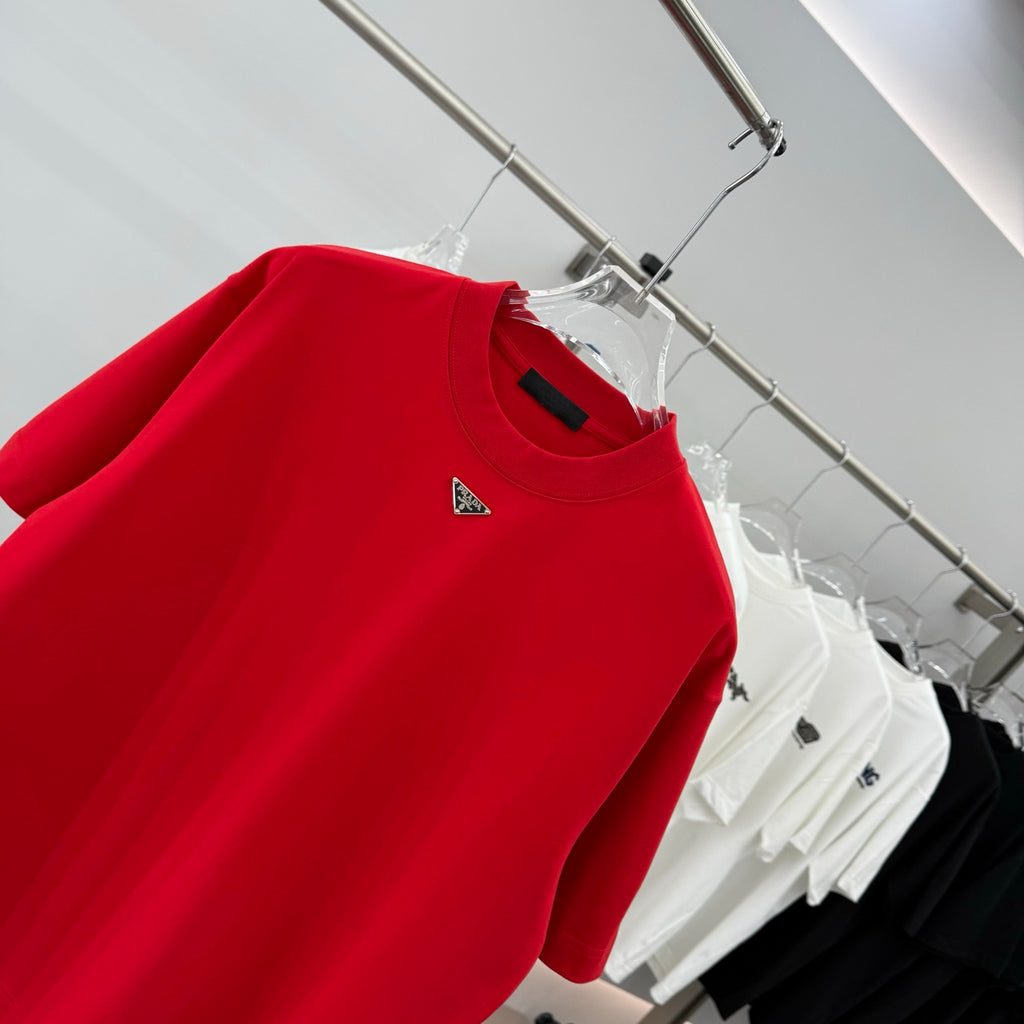 Prada red T-shirt close-up of crew neck and triangular logo on chest