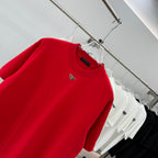 Prada red T-shirt close-up of crew neck and triangular logo on chest