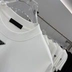 White crew-neck T-shirt with black chest label stripe and small logo details