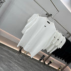 White short-sleeve T-shirt on hanger, triangular Prada badge at chest