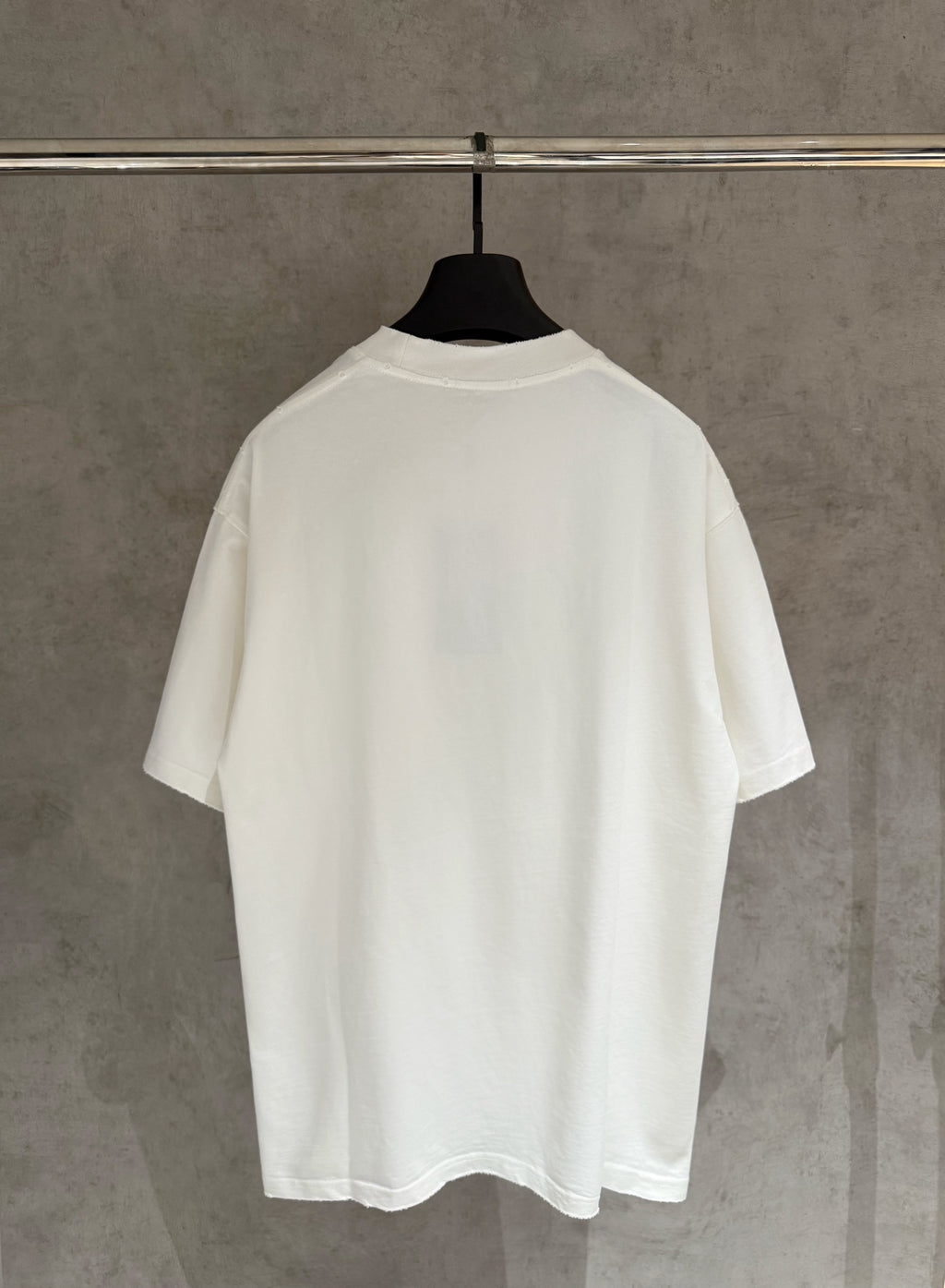 White short-sleeve T-shirt shown from the back, plain design