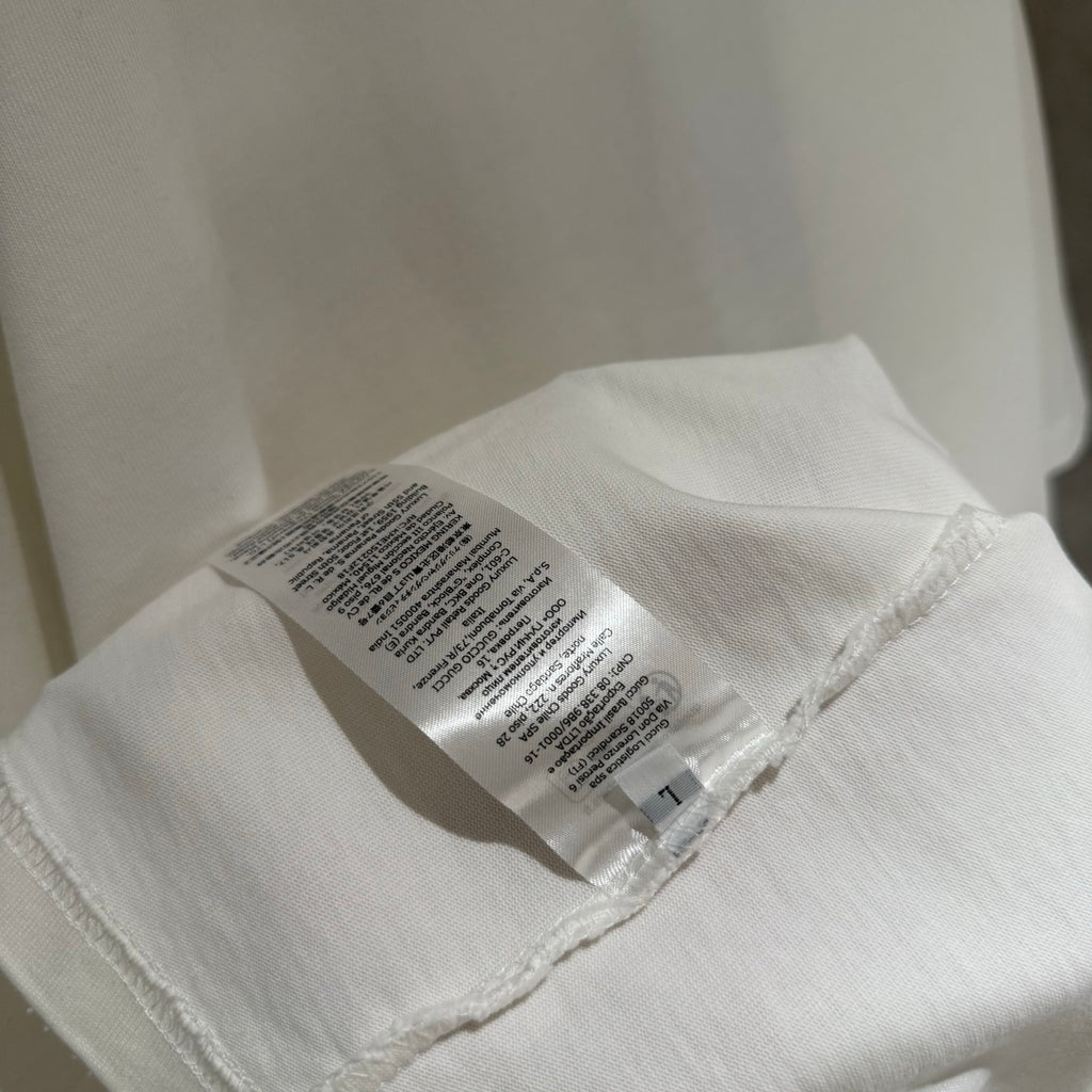 White T-shirt fabric tag stitched on the inside of the collar