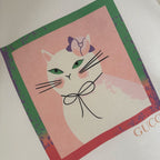 Close-up of cat graphic patch print on a white short-sleeve T-shirt
