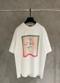 White short-sleeve T-shirt with colorful cat graphic and ribbon detail on front