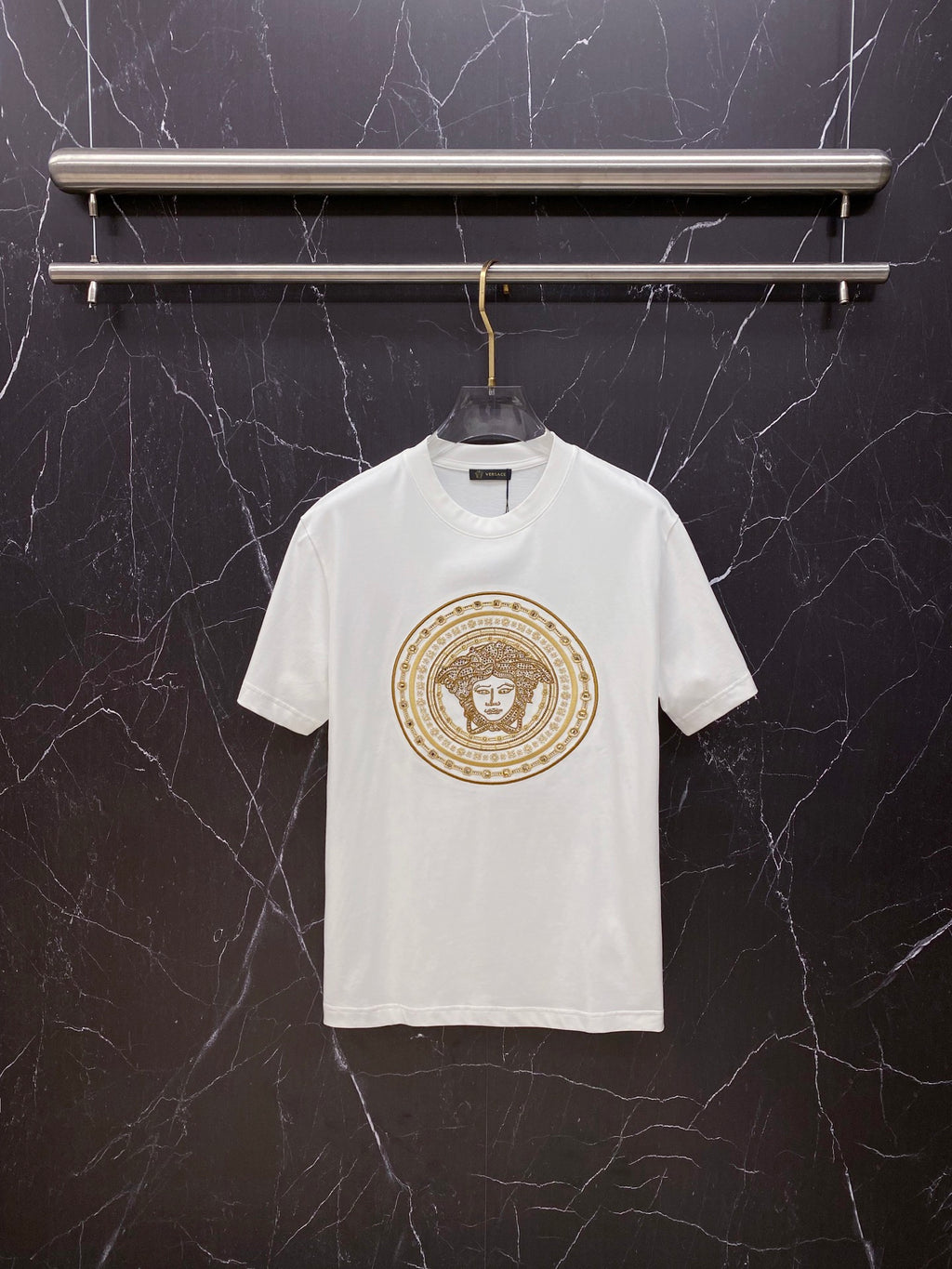Versace white crewneck T-shirt with gold ornate medallion graphic on chest