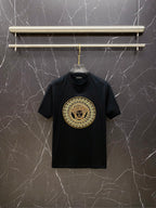 Versace black T-shirt with gold circular Medusa logo on chest