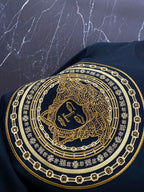 Versace black T-shirt chest graphic with gold Medusa medallion