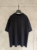 Black short-sleeve T-shirt with small chest logo detail on front