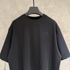 Black short-sleeve T-shirt close view of front logo emblem on chest