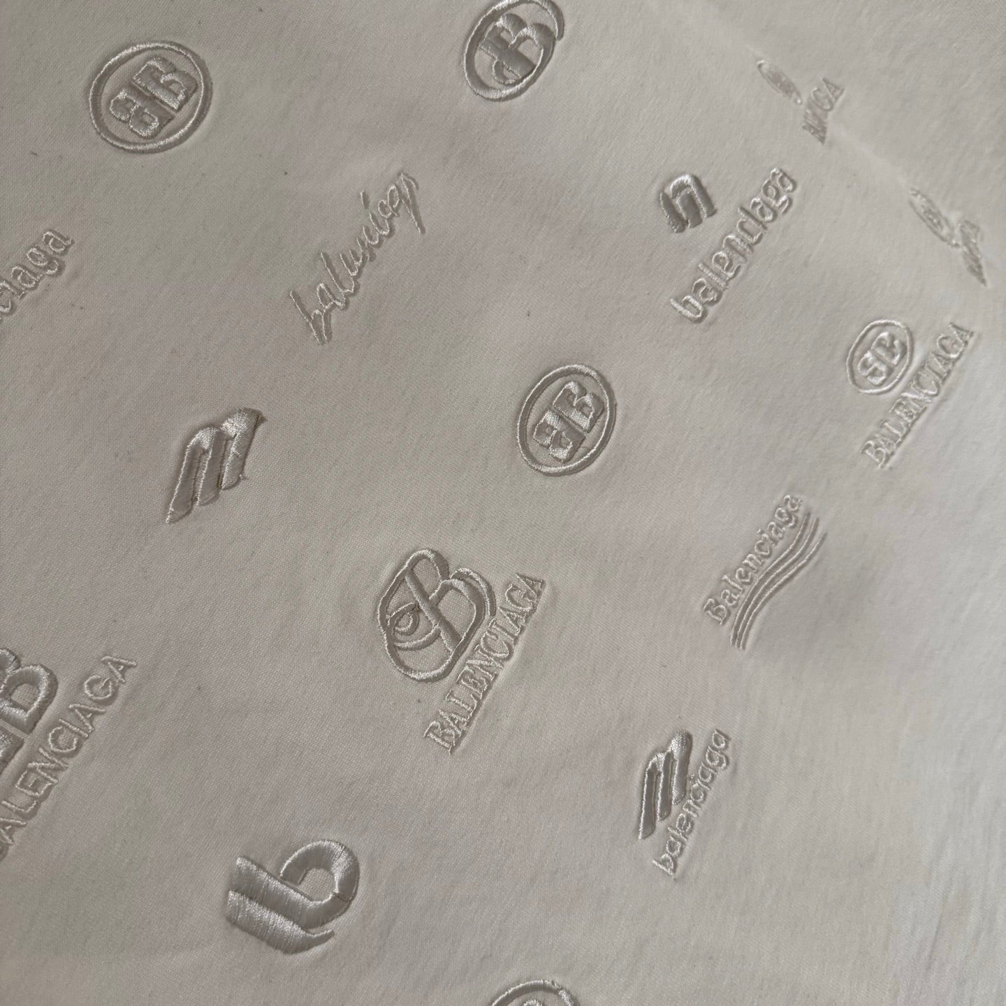 Balenciaga white T-shirt allover embossed logo icons pattern on the back fabric